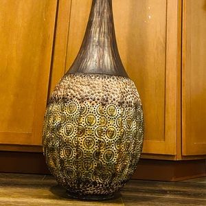 Tall metal vase